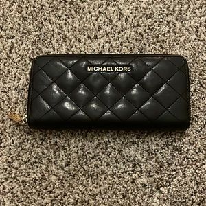 Michael Kohrs black leather quilted wallet